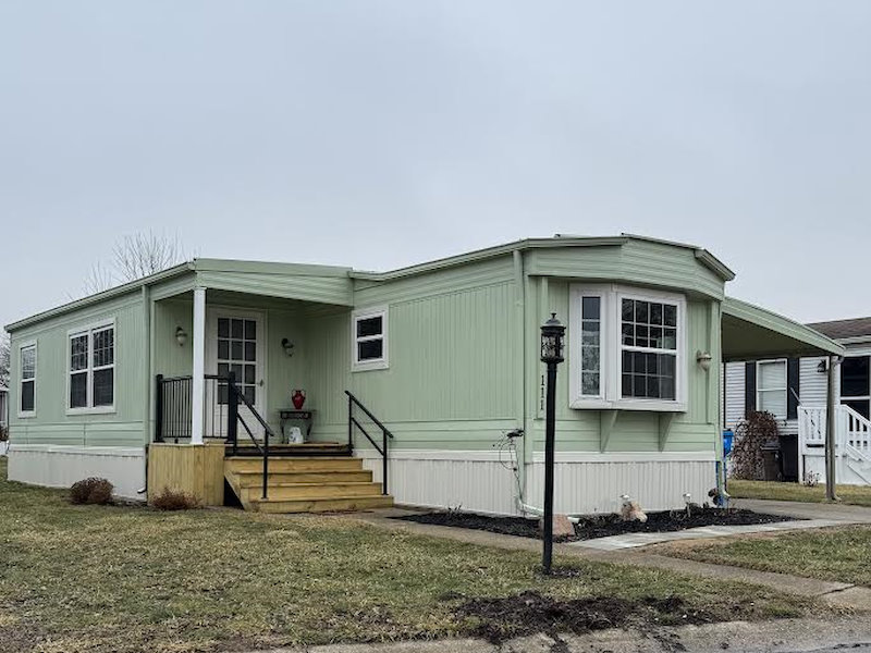Light blue siding on double-wide manufactured home.